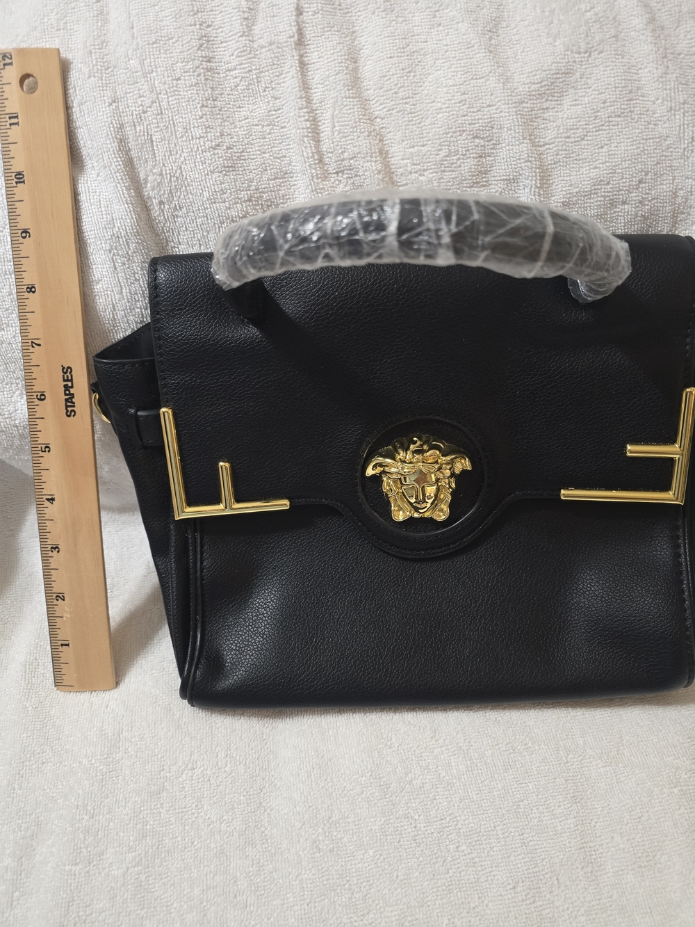 Black Leather Top-Handle Bag with Gold Medallion